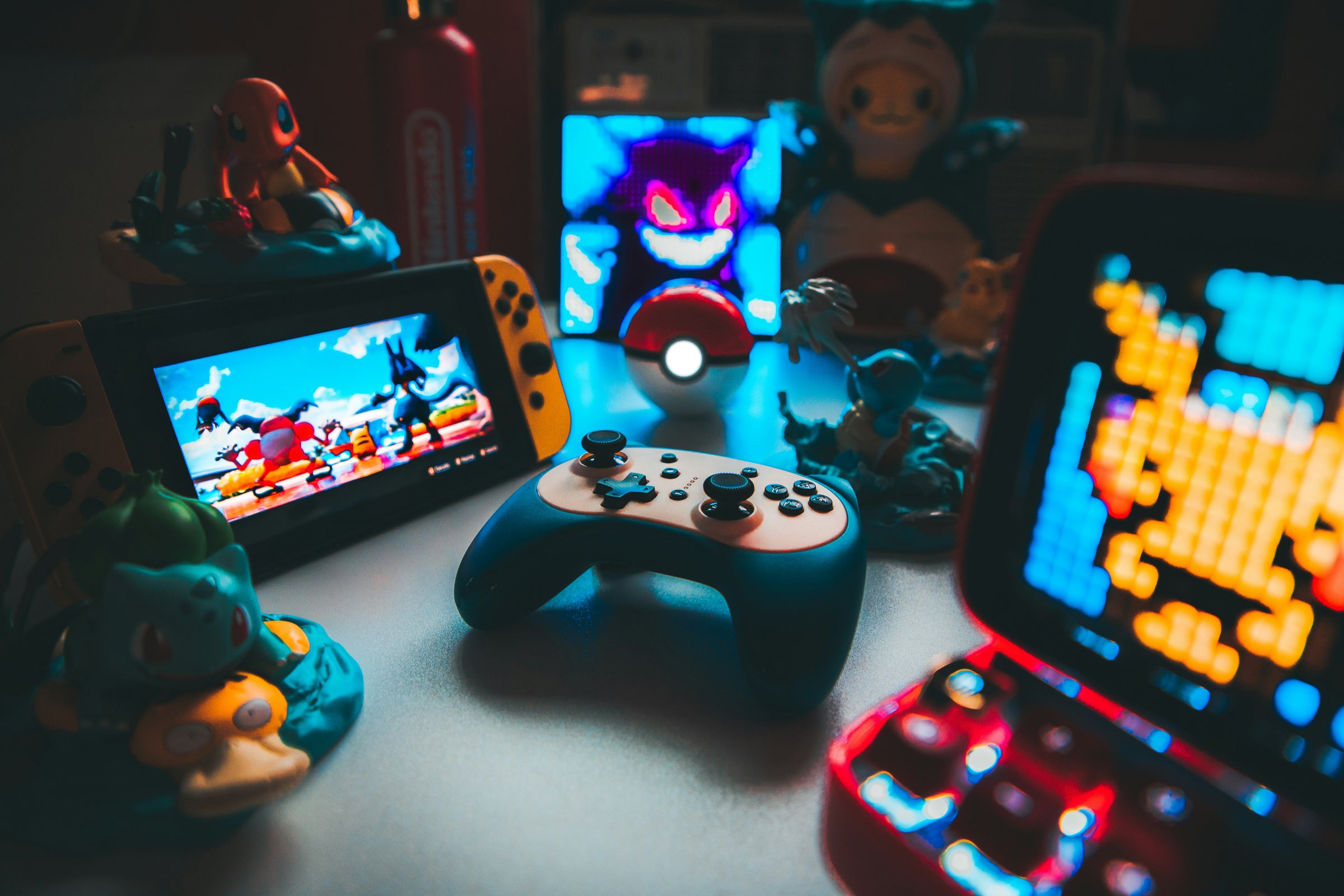 Nintendo gaming consoles and Pokémon collectibles setup — BLUELIGHT